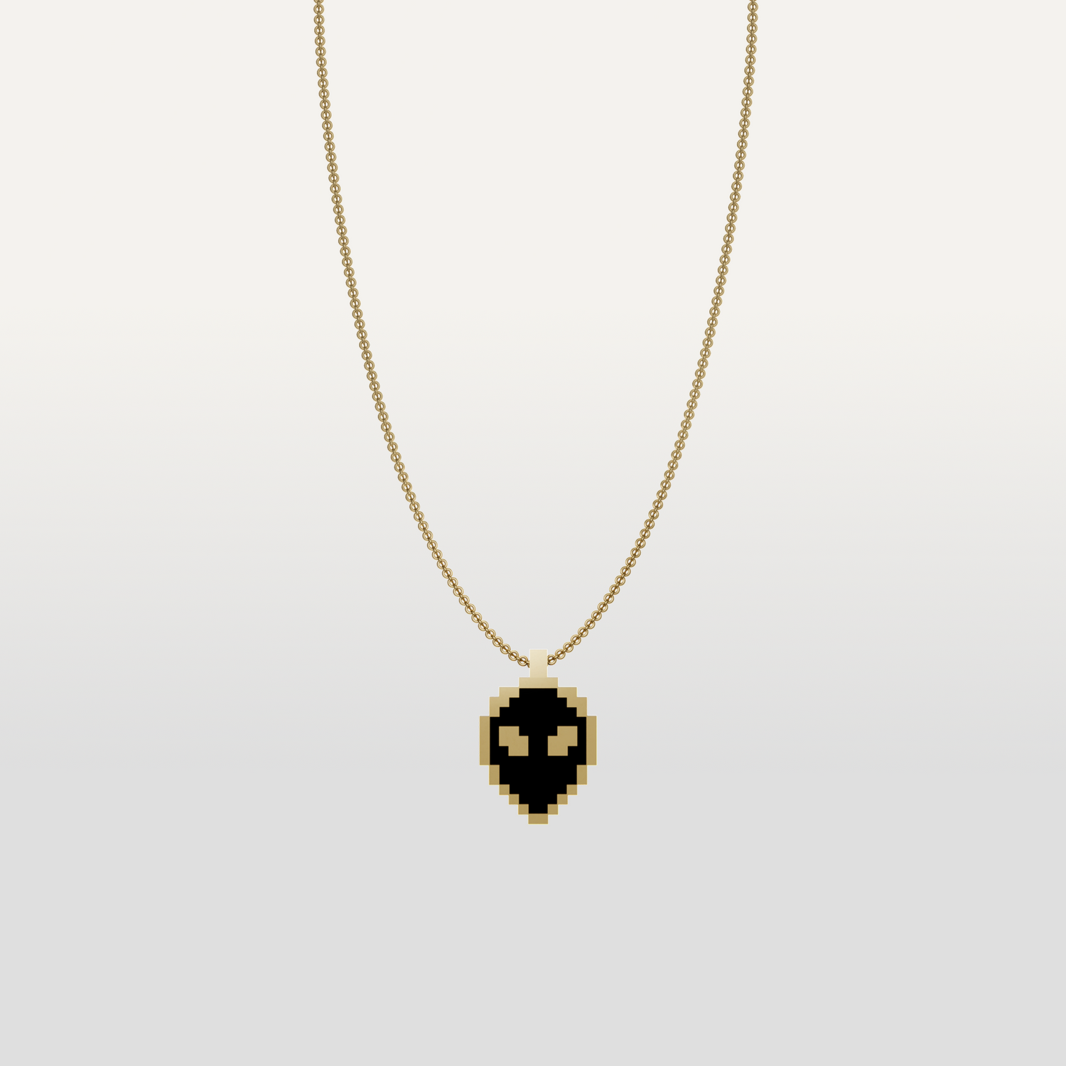 Alien necklace pendant in gold icon by Susan Kare