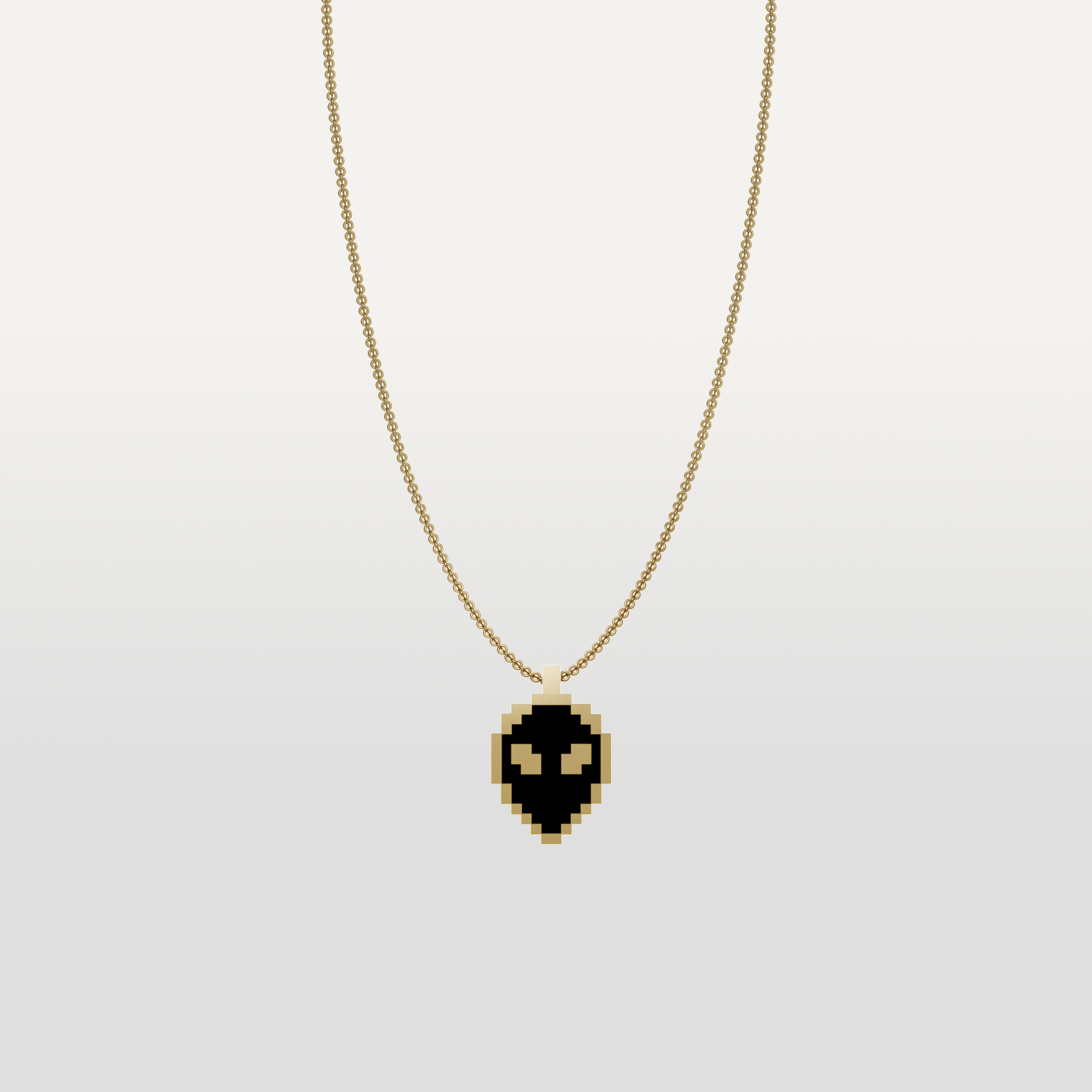 Alien necklace pendant in gold icon by Susan Kare