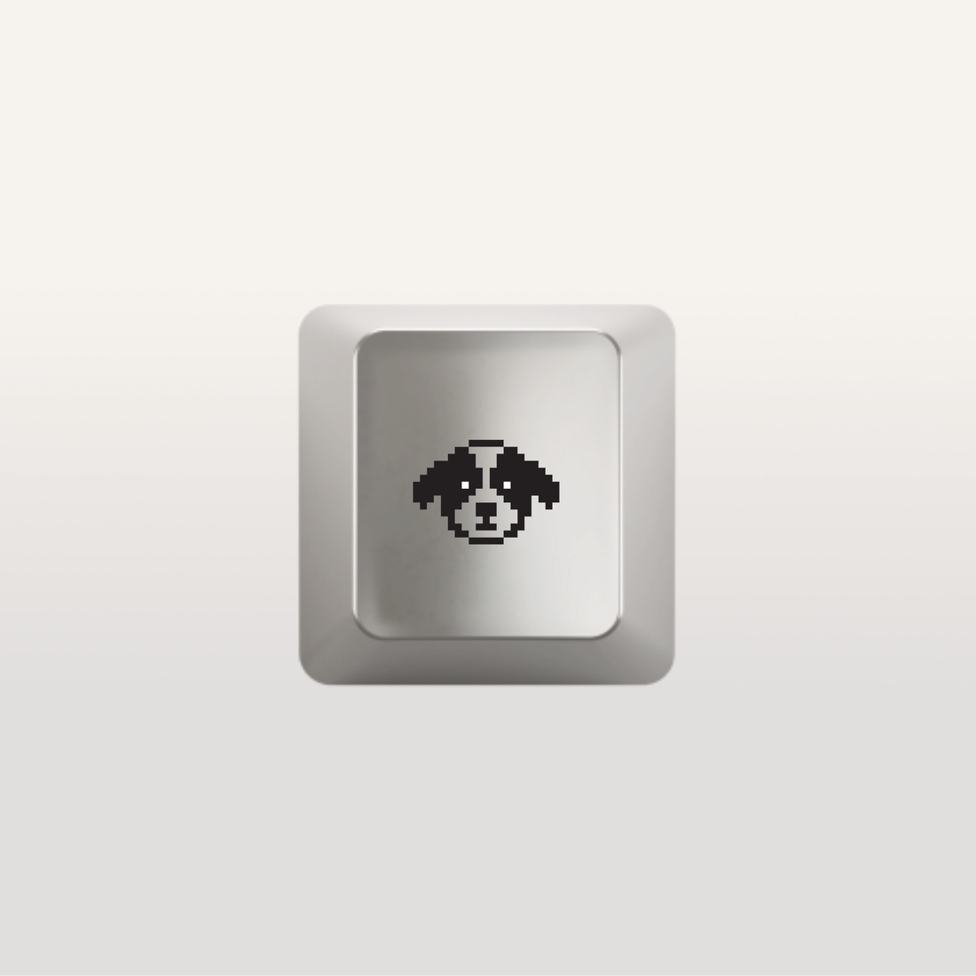 Keyboard key with dog icon by Susan Kare in silver 