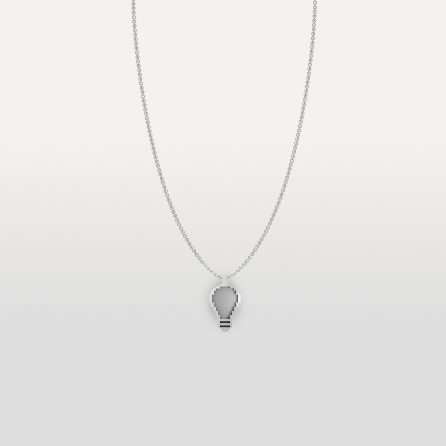 Lightbulb-shaped necklace pendant in silver by Susan Kare