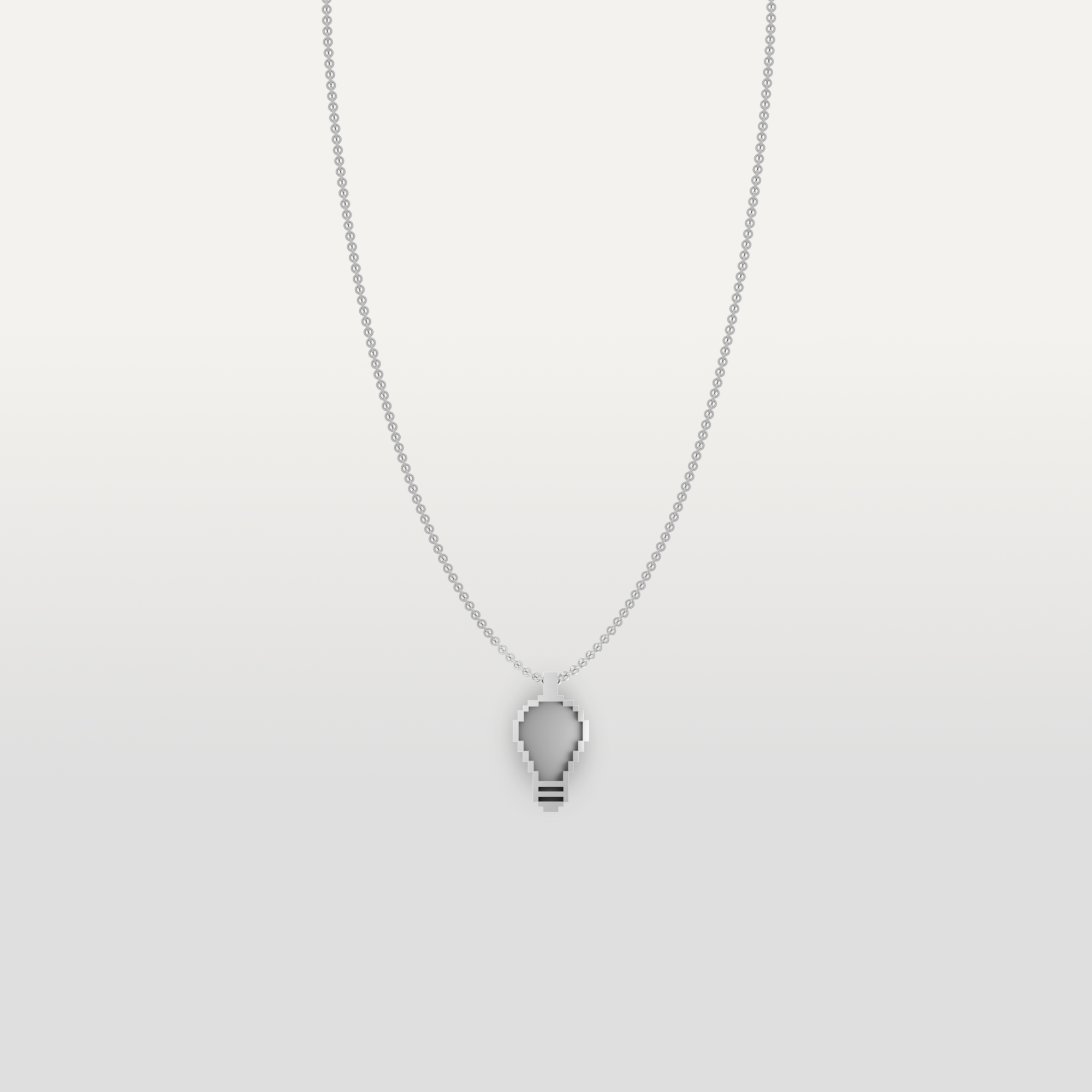 Lightbulb-shaped necklace pendant in silver by Susan Kare