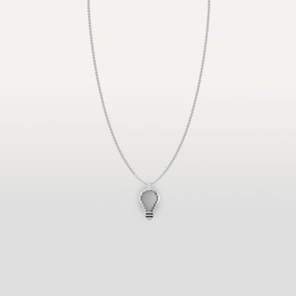 Lightbulb-shaped necklace pendant in silver by Susan Kare